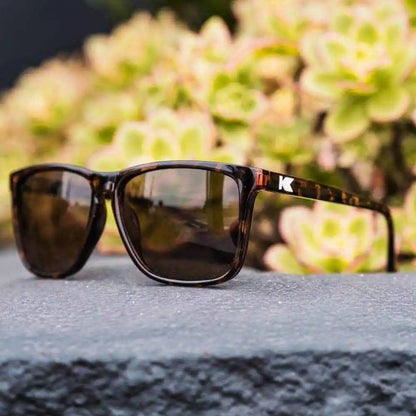 Lifestyle photo of Glossy Tortoise Shell / Amber Fast Lanes Sunglasses