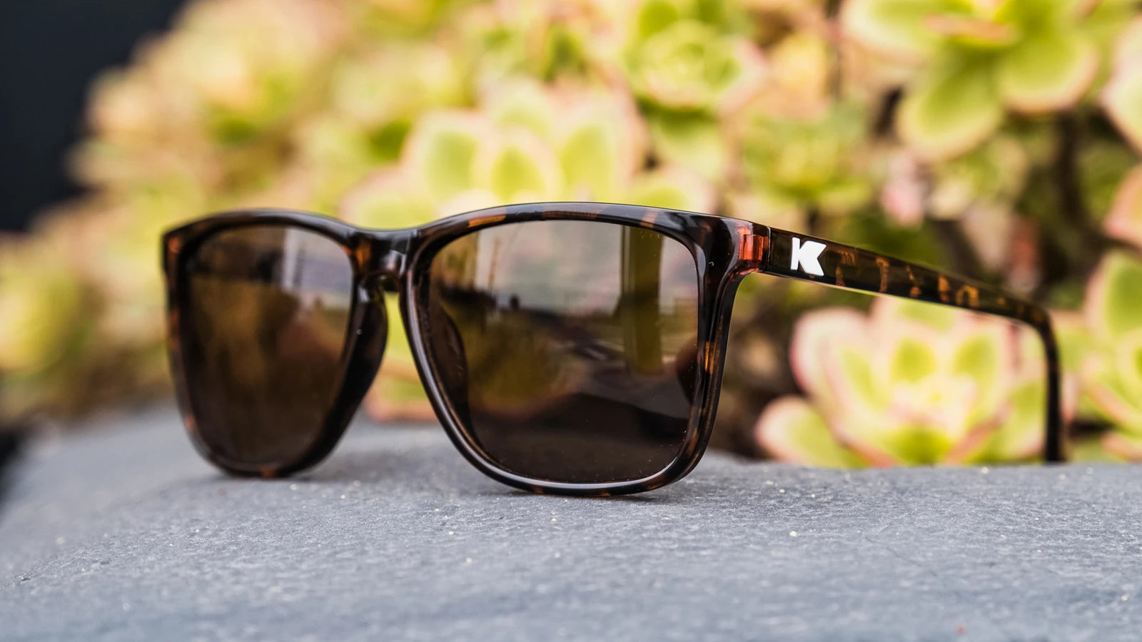 Lifestyle photo of Glossy Tortoise Shell / Amber Fast Lanes Sunglasses