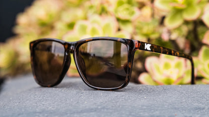 Lifestyle photo of Glossy Tortoise Shell / Amber Fast Lanes Sunglasses