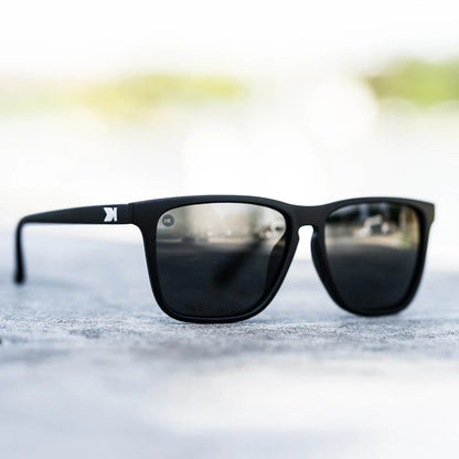 Lifestyle photo of Matte Black / Smoke Fast Lanes Sunglasses