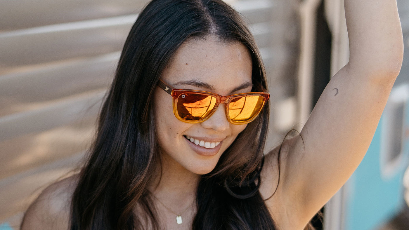 Woman wearing firewood premiums sunglasses