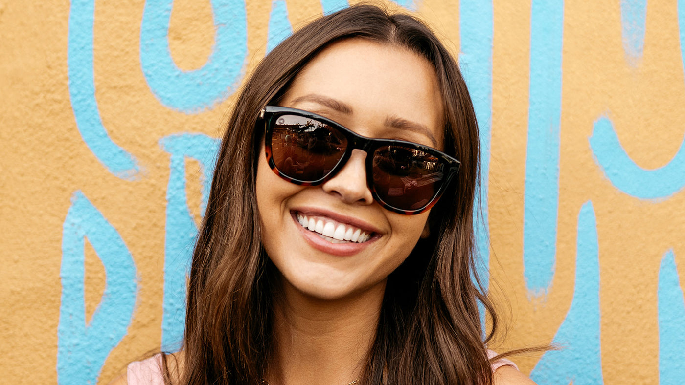 Woman wearing Glossy Black and Tortoise Shell Fade / Amber Premiums Sunglasses