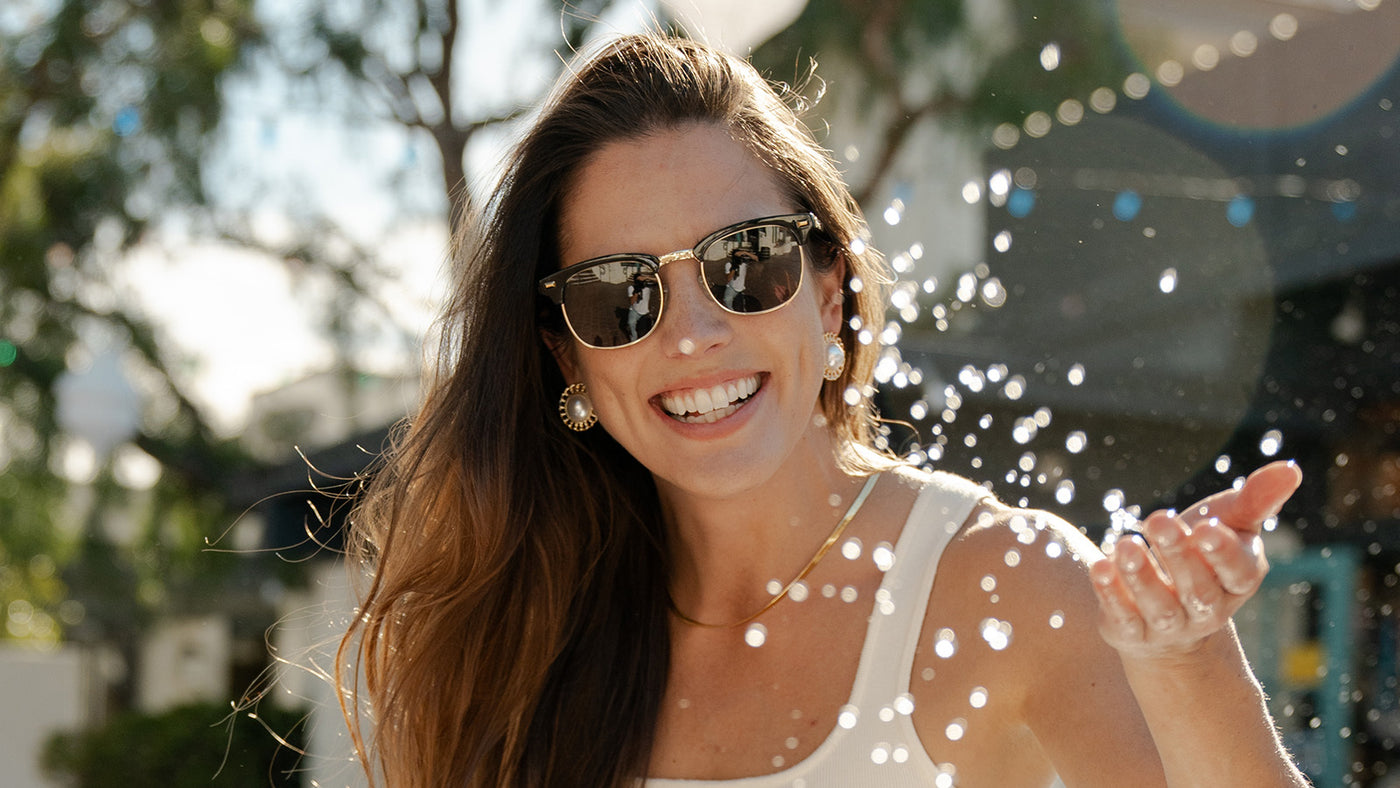 Woman wearing Glossy Black & Gold Brooklines Prescription Glasses