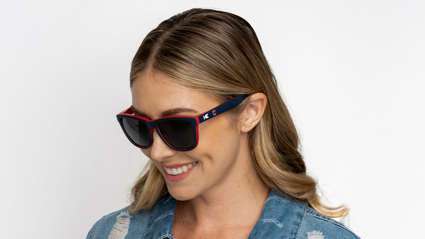 Woman wearing MLB Cleveland Guardians Sunglasses