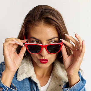 Woman wearing Knockaround x Hello Kitty Premiums sunglasses