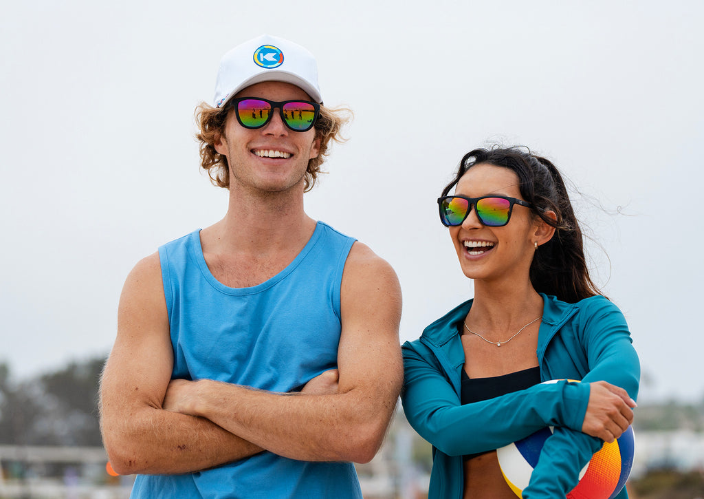 Man wearing Rainbow On black Premiums sunglasses. Woman wearing Rainbow On Black Fast Lanes sunglasses