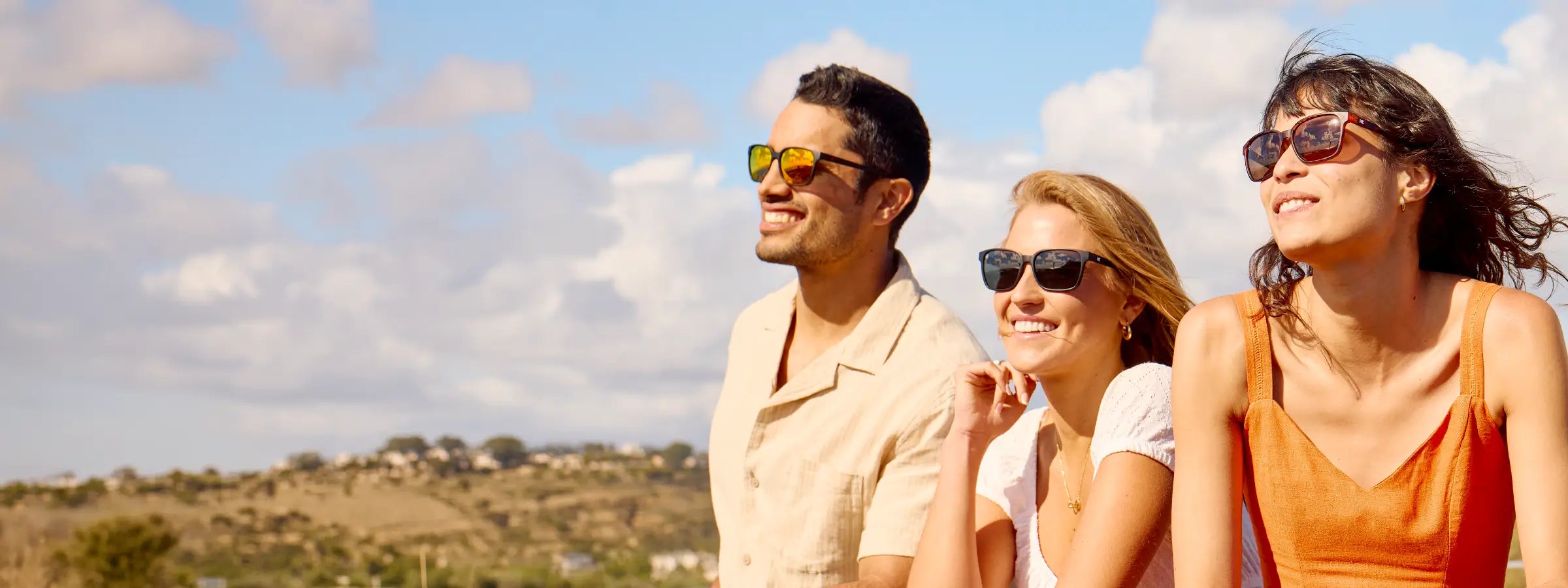 Men and women wearing Knockaround Day Trips sunglasses outside