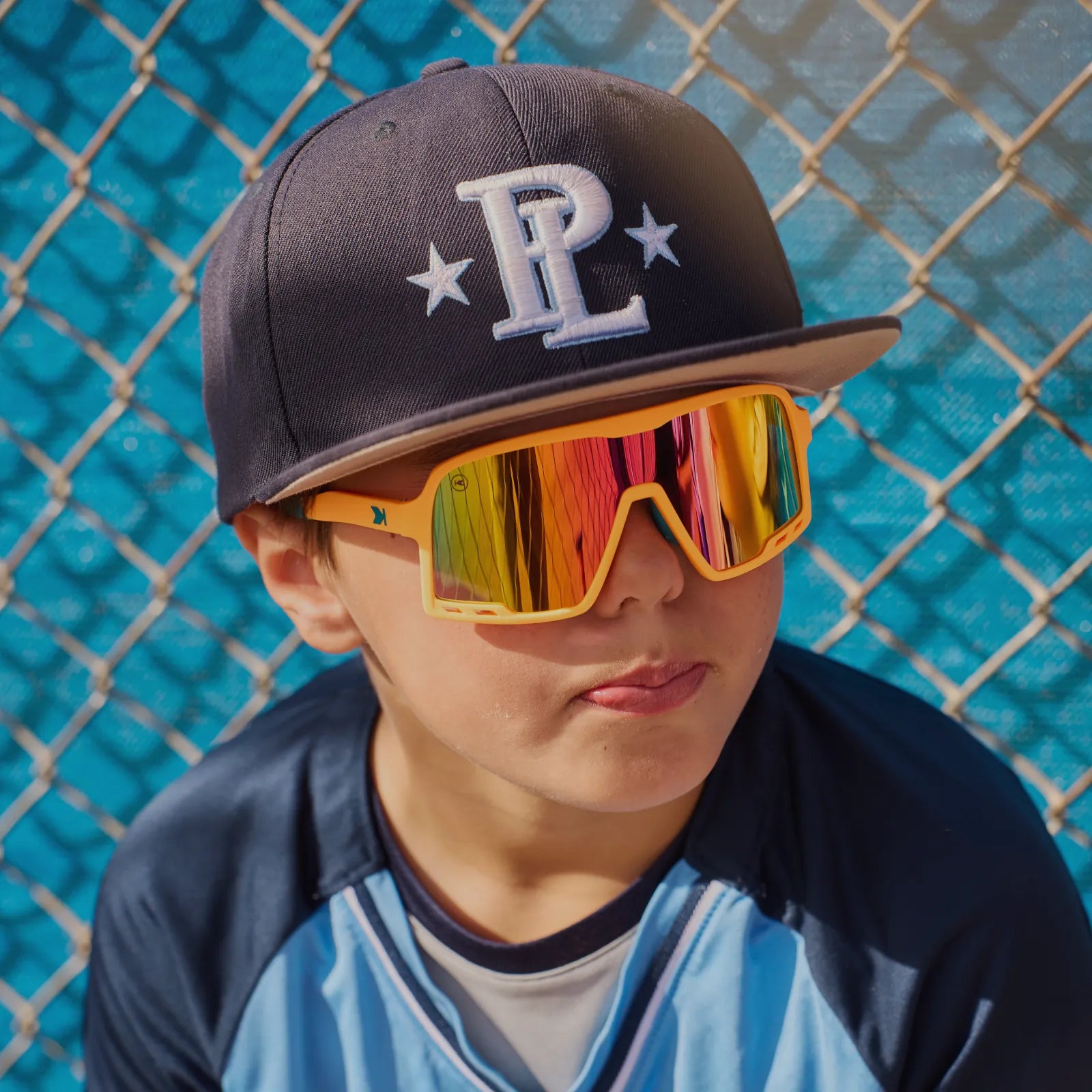 Boy wearing Hot Streak Kids Campeones Sunglasses