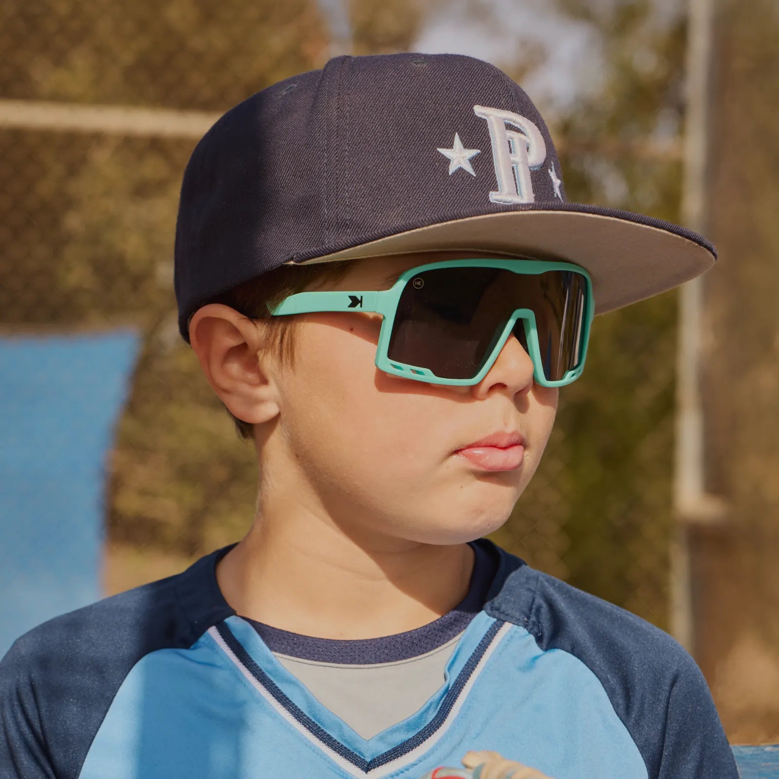 Boy wearing Mint Condition Kids Campeones Sunglasses