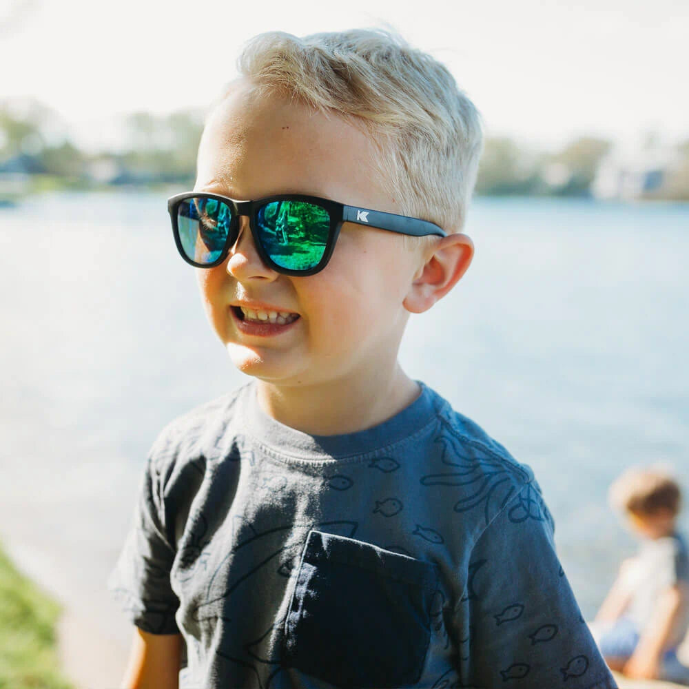 Boy wearing Black / Green Moonshine Kids Premiums Sunglasses
