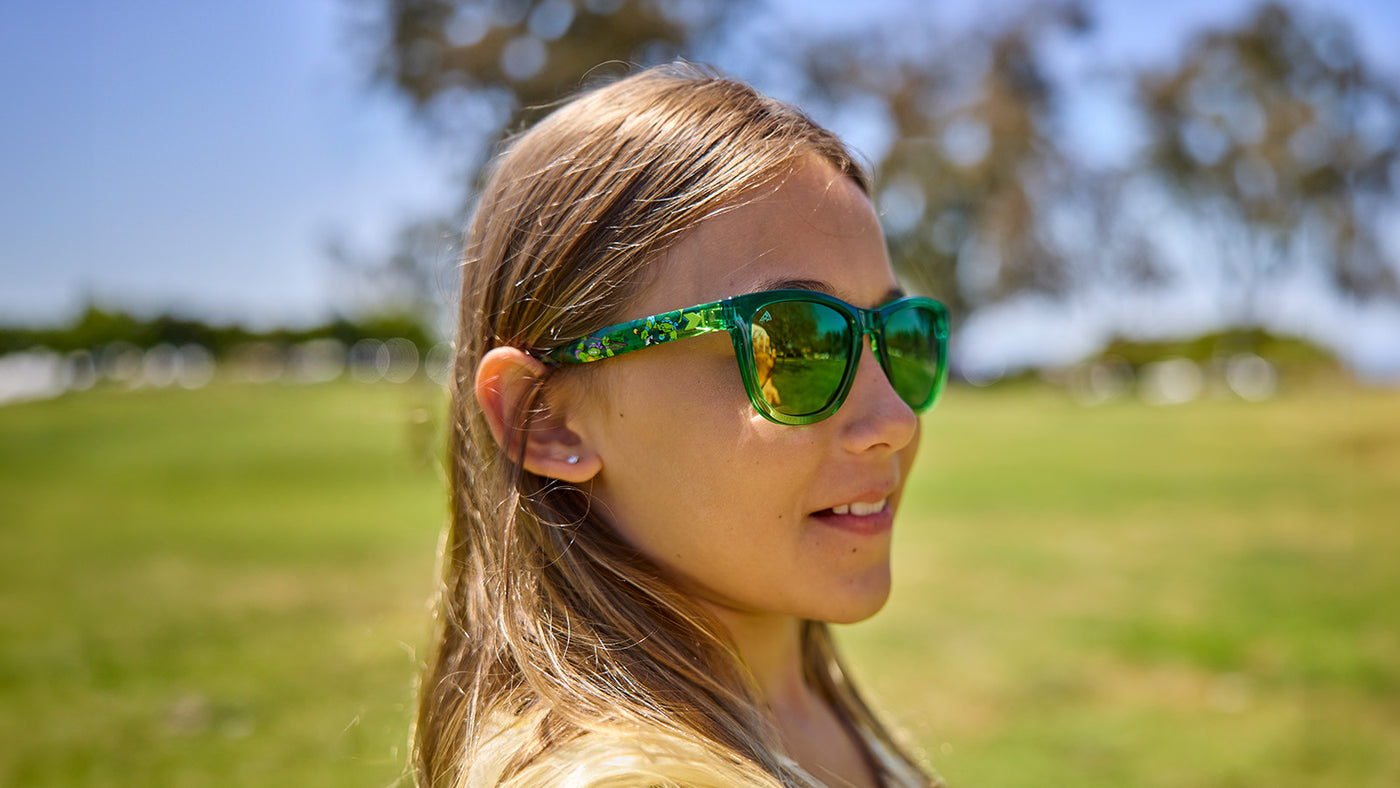 Girl Wearing Knockaround and Teenage Mutant Ninja Turtle Premiums Sunglasses, adult size pictured