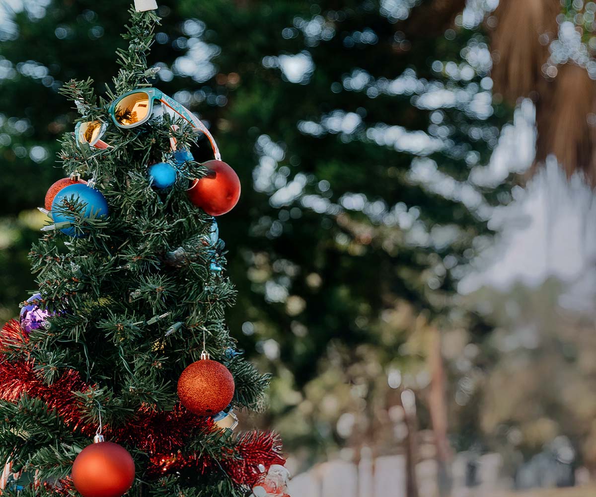 Decorative Knockaround Christmas tree with colorful ornaments against a snowy background