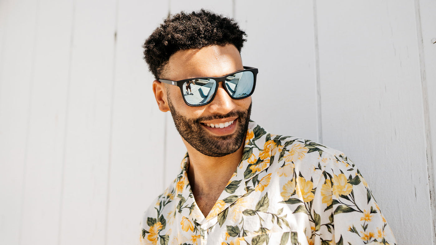 Man wearing Matte Black / Sky Blue fast lanes sunglasses