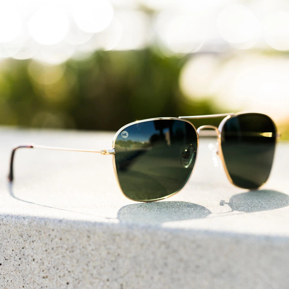 Lifestyle photo of Gold / Aviator Green Mount Evans Sunglasses