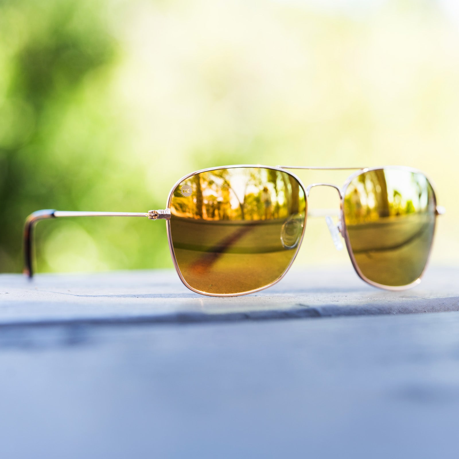 Lifestyle photo of Rose Gold / Copper Mount Evans Sunglasses