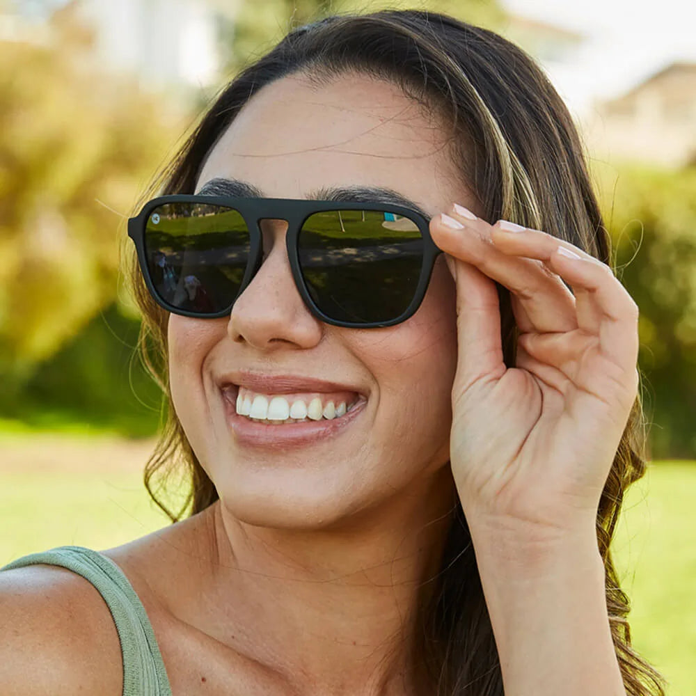 Women wearing Black on Black Pacific Palisades Sunglasses