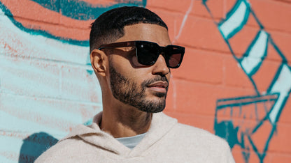 Male wearing sunglasses with Piano Black Frames and Polarized Black Smoke Lenses