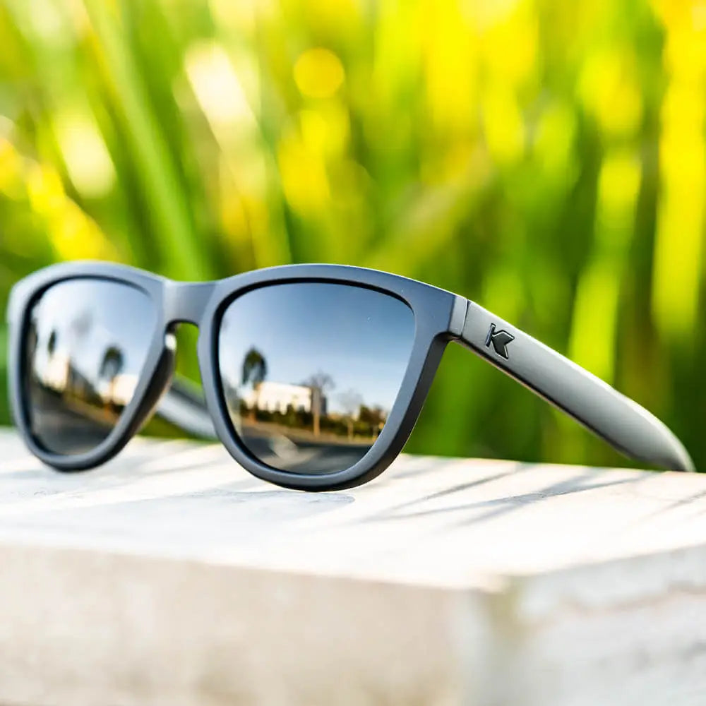 Lifestyle photo of Black on Black Premiums Sunglasses
