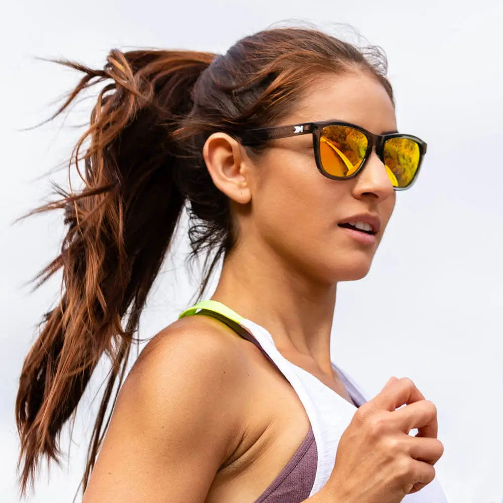 Women wearing Clear Grey / Sunset Premiums Sport Sunglasses
