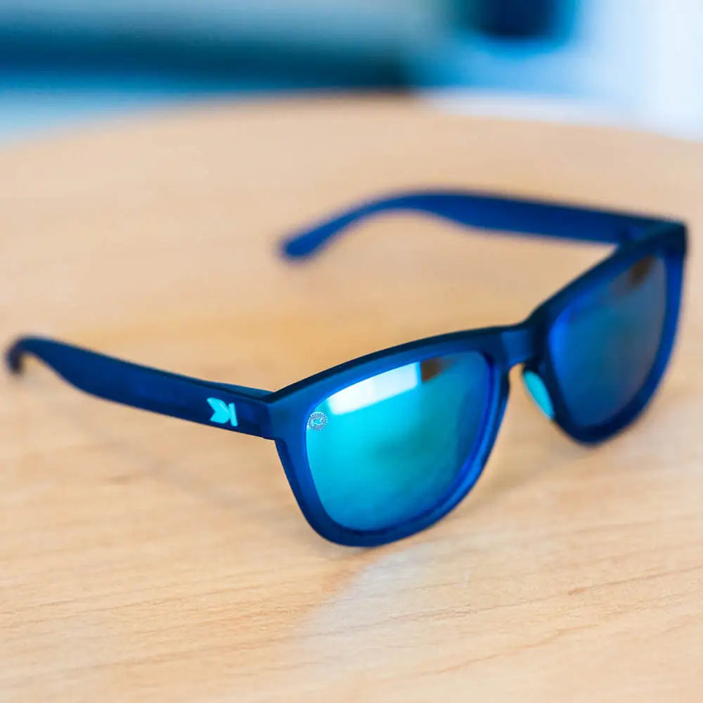 Lifestyle photo of Rubberized Navy / Mint Premiums Sport Sunglasses
