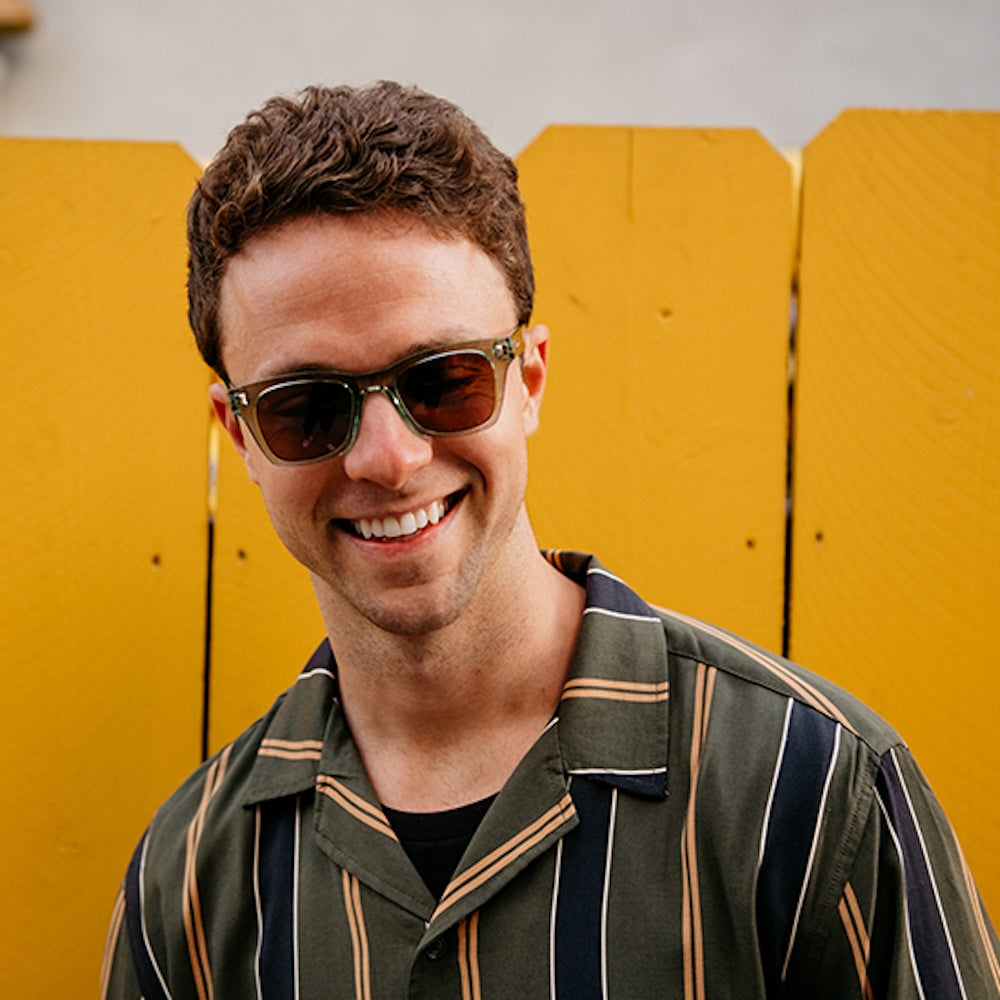 Male model wearing Aged Sage Seventy Nines sunglasses