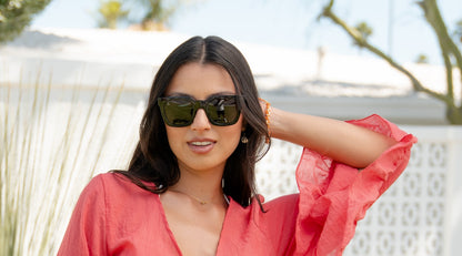 Female wearing sunglasses with Piano Black Frames and Polarized Black Smoke Lenses