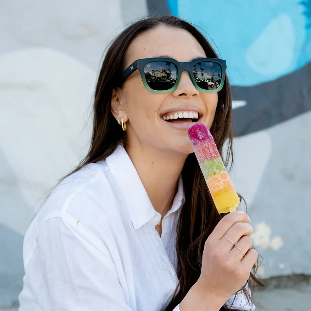 Woman wearing Rising Tide Songbirds sunglasses