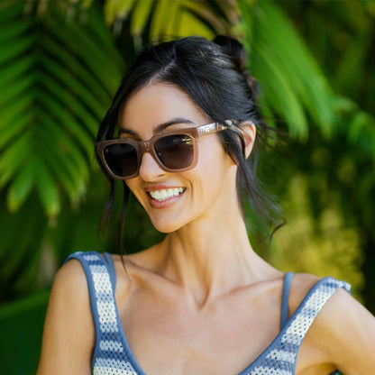 Woman wearing Rose Latte Songbirds sunglasses