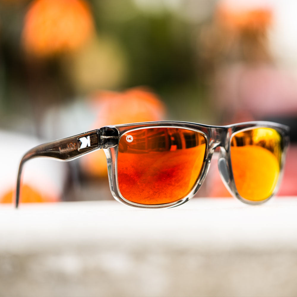 Lifestyle photo of Clear Grey / Red Sunset Torrey Pines Sport Sunglasses
