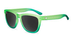 Sunglasses with green fade frames and polarized smoke lenses
