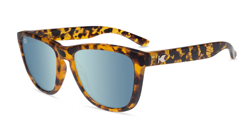 Matte amber ink sunglasses with sky blue lenses