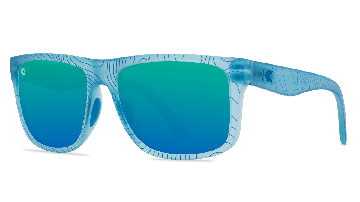 Sunglasses with blue topographic frames and polarized green lenses, threequarter
