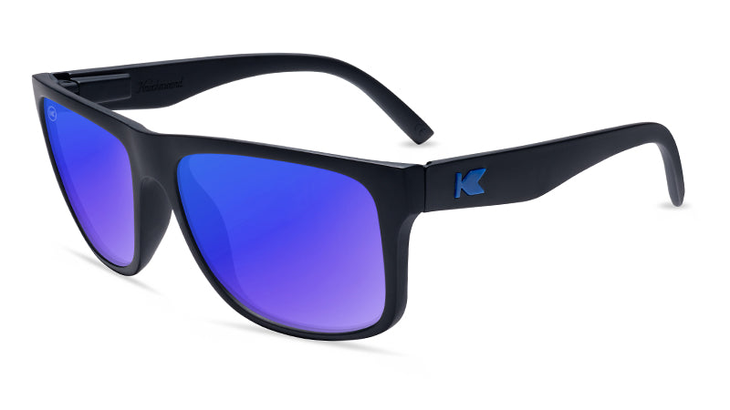 Matte black Knockaround sunglasses with blue moonshine lenses
