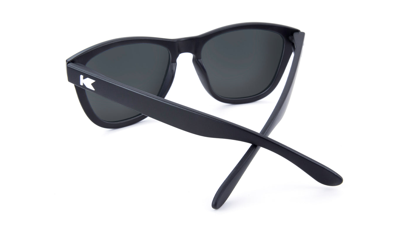 Sunglasses with Matte black frames White K logos Polarized green moonshine mirrored lenses