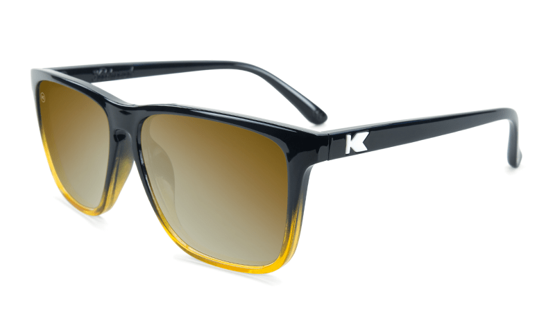 Glossy black sunglasses with square gold lenses