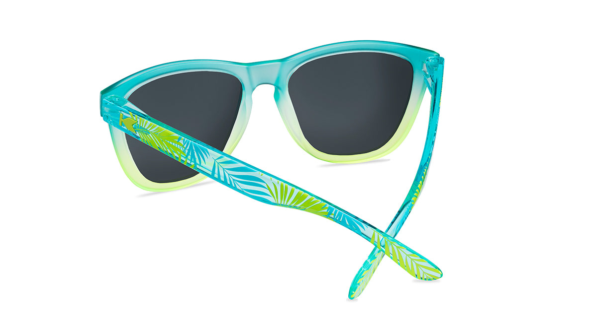Sunglasses with aqua and yellow frames and polarized yellow lenses, back