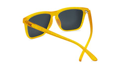 Sunglasses wtih yellow topographic frames and polarized peach lenses, back