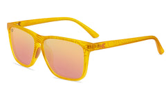 Sunglasses wtih yellow topographic frames and polarized peach lenses, flyover