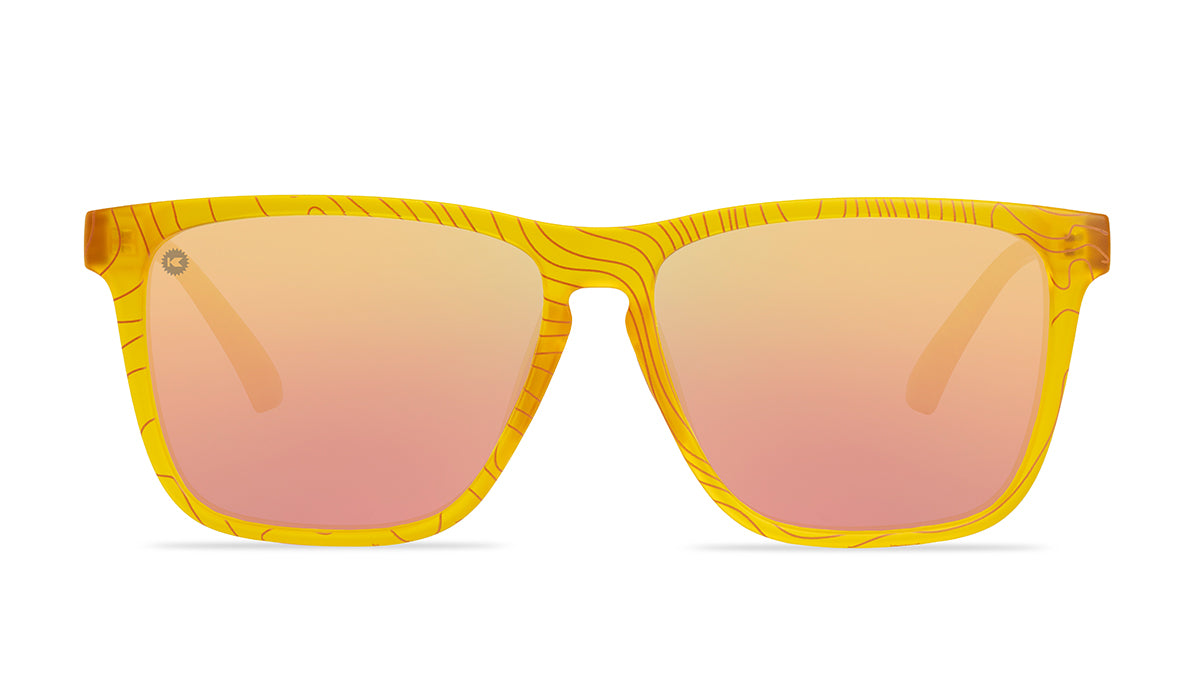 Sunglasses wtih yellow topographic frames and polarized peach lenses, front