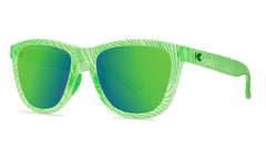 Sunglasses with green topographic frame and polarized green lenses, threequarter