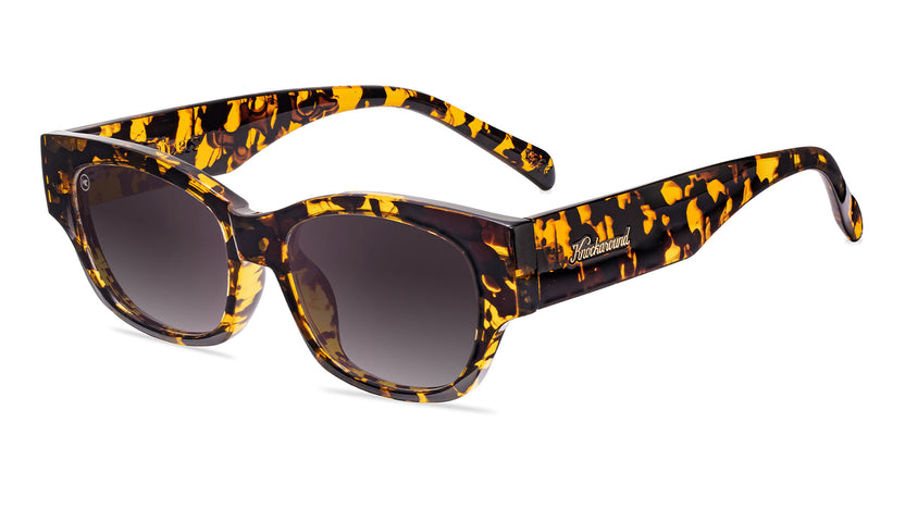 Sunglasses with an inky amber tortoise frame and polarized smoke gradient lenses, Flyover
