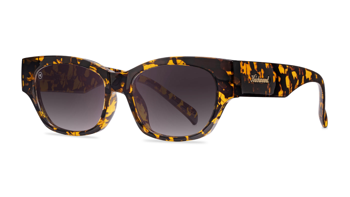 Sunglasses with an inky amber tortoise frame and polarized smoke gradient lenses, Threequarter