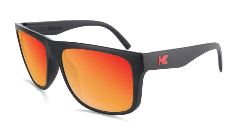 Large black sunglasses with square red lenses