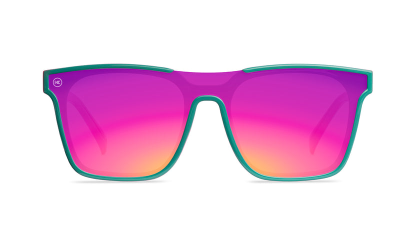 Sunglasses with a teal and pink frame with polarized pink and purple lenses, front