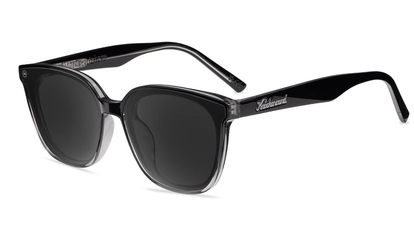 Sunglasses with a black frame with polarized black lenses, flyover