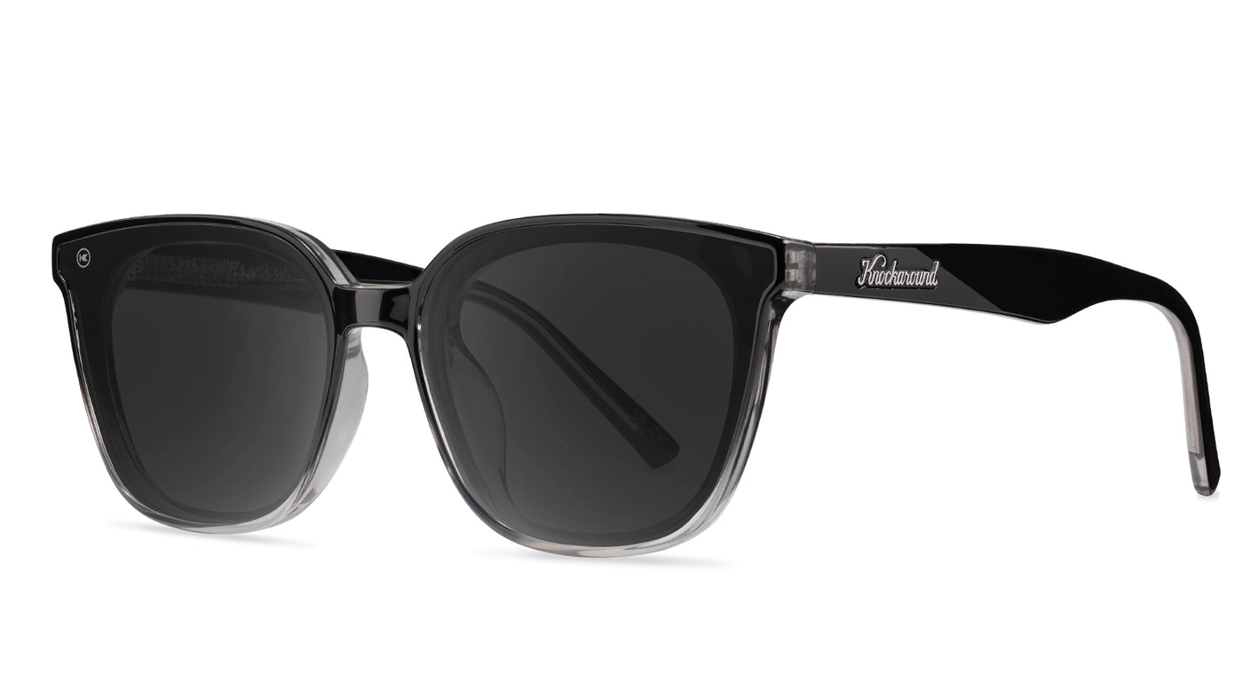 Sunglasses with a black frame with polarized black lenses, threequarter