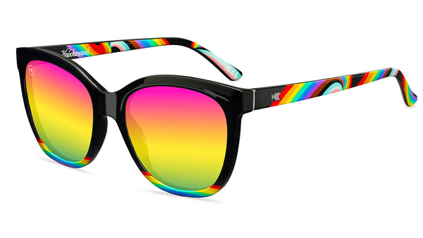 Sunglasses with Glossy black fronts with rainbow accent at bottom, Progress Pride color swirl across arms Silver K-logos Polarized rainbow lenses