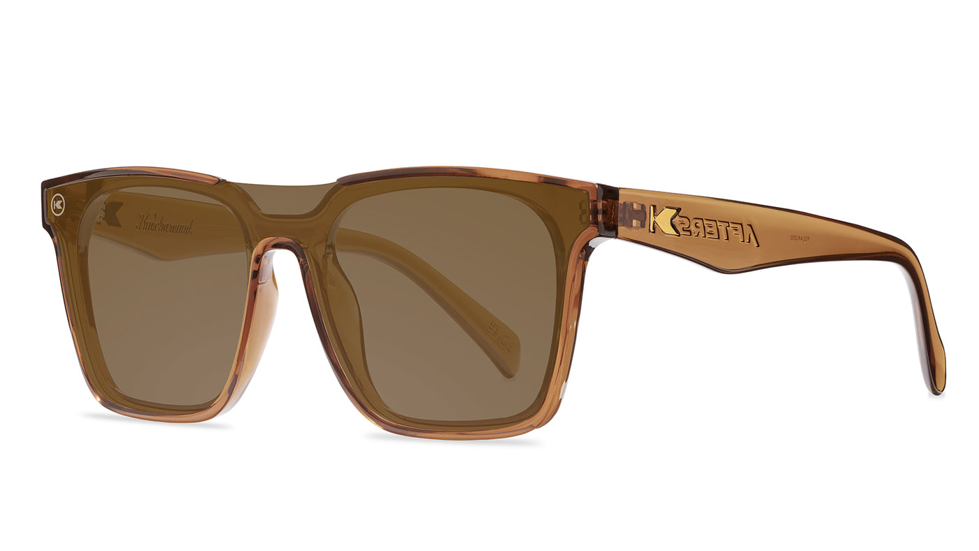 Sunglasses with an amber frame with polarized amber lenses, threequarter