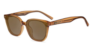 Sunglasses with a amber frame with polarized amber lenses, flyover