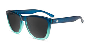 Sunglasses with Deep Blue to Light Blue Frames and Polarized Black Lenses, Flyover